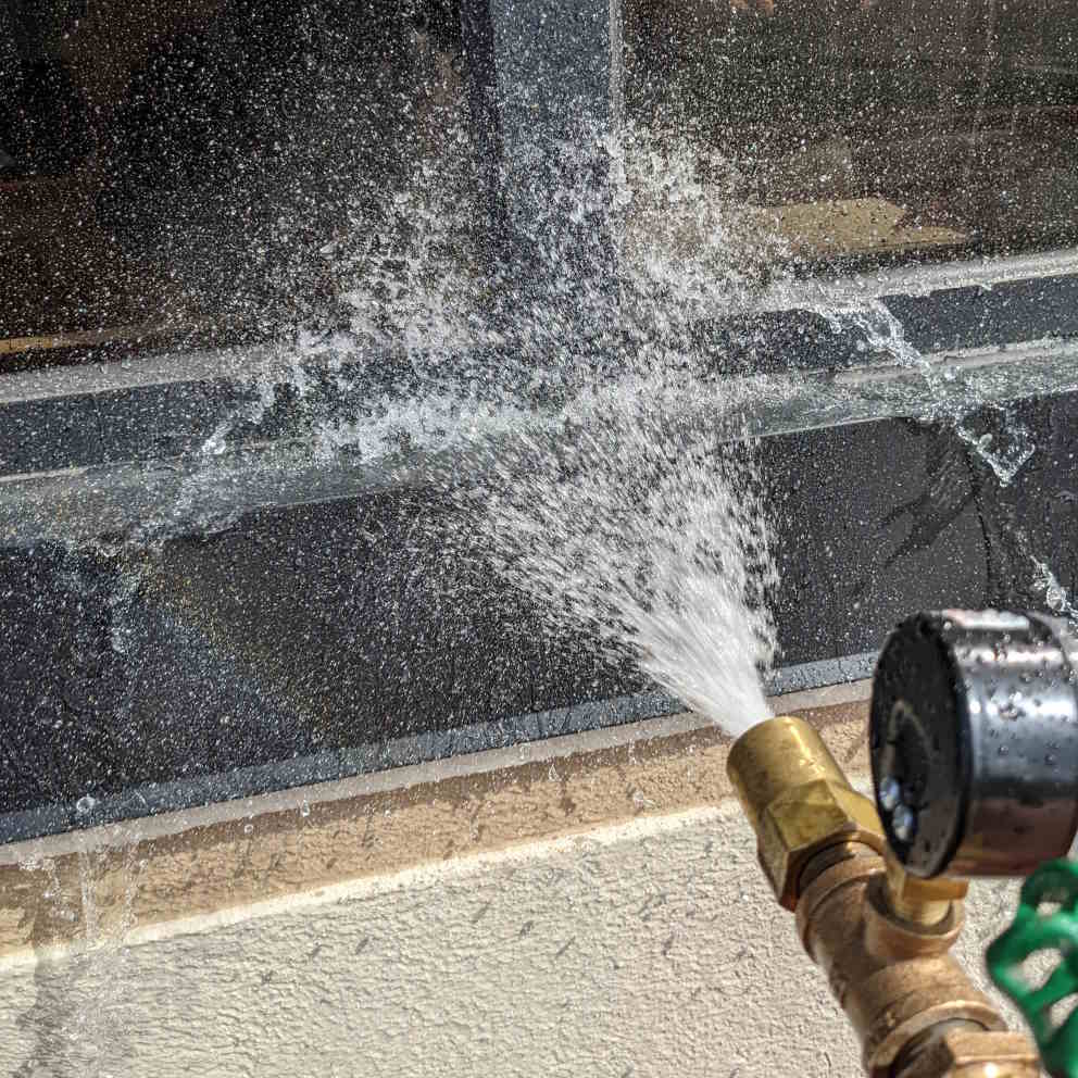 Hightower Labs conducting lab-quality field testing for water resistivity of building envelope systems.