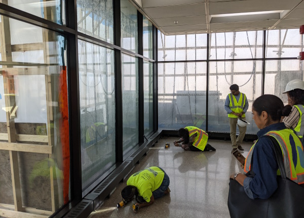 ASTM E1105 test viewed from the interior, on a large curtain wall system